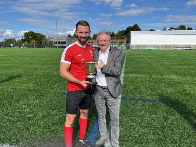 Armagh & Down captain Phil Neill receiving the Buckley Cup from League Vice Chairman Alan Buchanan