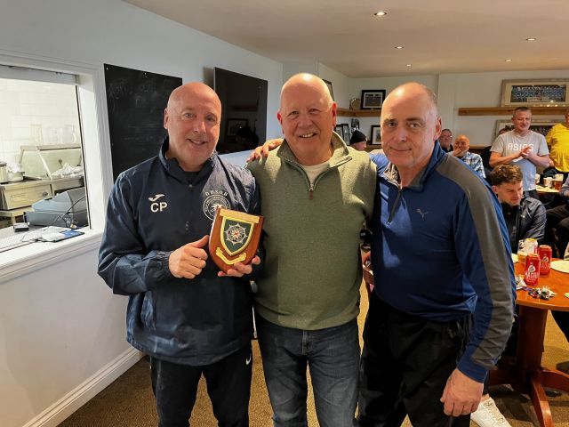 League chairman Alan McClune presenting PSNI plaque to Douglas High School representatives