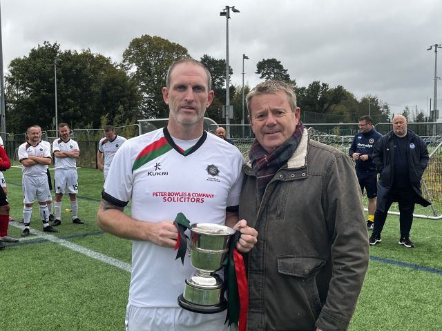 Winning captain William Wharry receiving the Gray Cup from Alastair Gray