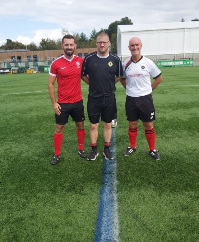 Two captains Philip Neill & Jeremy Dale with referee Minty Murray before the Buckley final