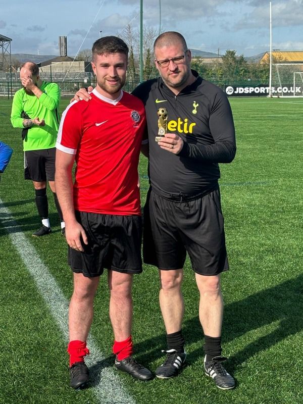 receiving his Man of the Match trophy from committee member Minty Murray