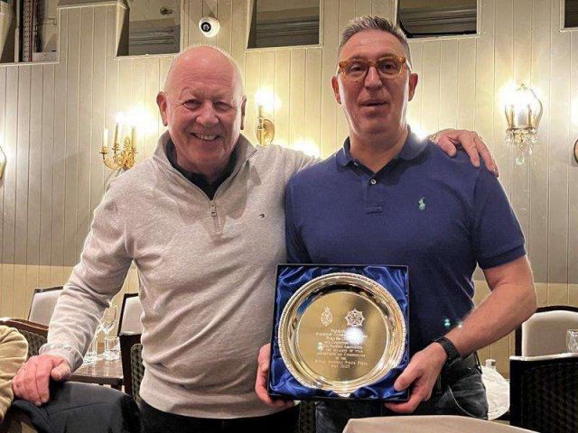 Outgoing DCU football President Muir Clark being presented with a commerative tray on his promotion 