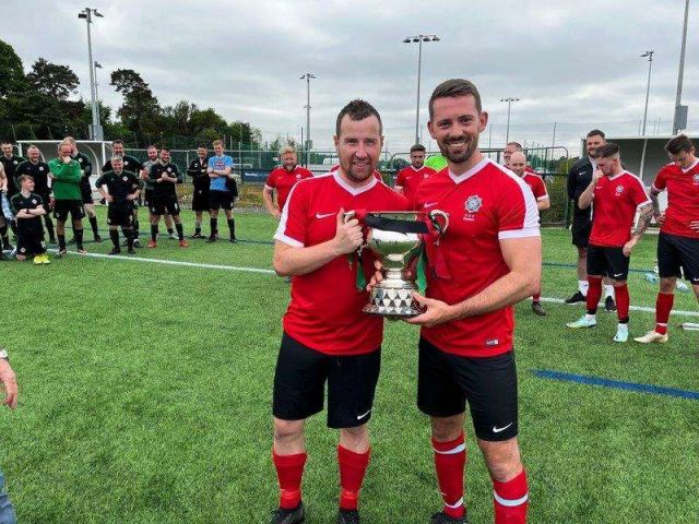 Armagh & Down team manager Stevie Lawson & team captain Phil Neill with the McAleavey Cup