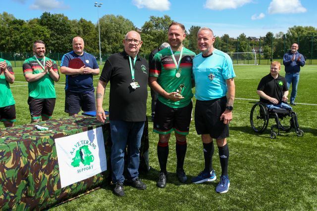 Matty Holden receiving his Player of the Tournament trophy from AAVS management